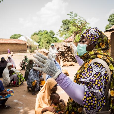 Suwaiba Yakubu Jubrin, Head of Programmes for ActionAid Nigeria informs members of Gwalada community about the novel Corona virus